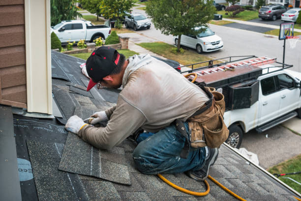 Professional Storm Damage Roof Repair technician working in White Plains, VA